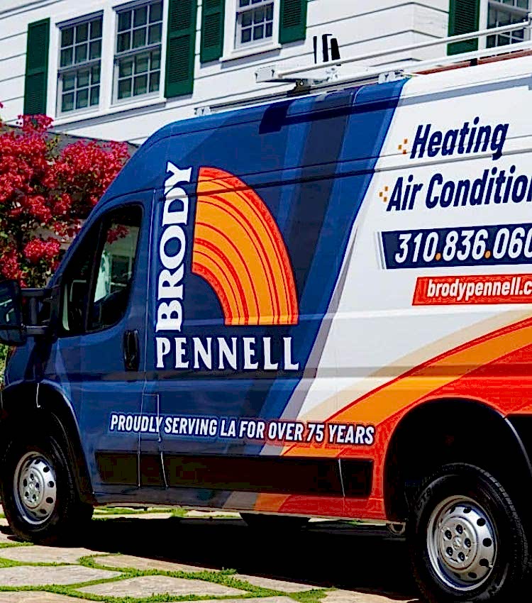 Image of a Brody Pennell service van parked infront of a customers home
