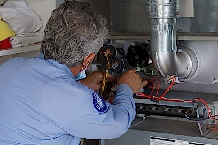 Image of an heater repair specialist in Los Angeles working on a system
