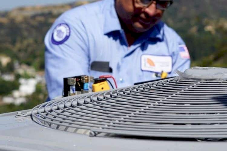 Image of an AC repair specialist in Los Angeles working on a system